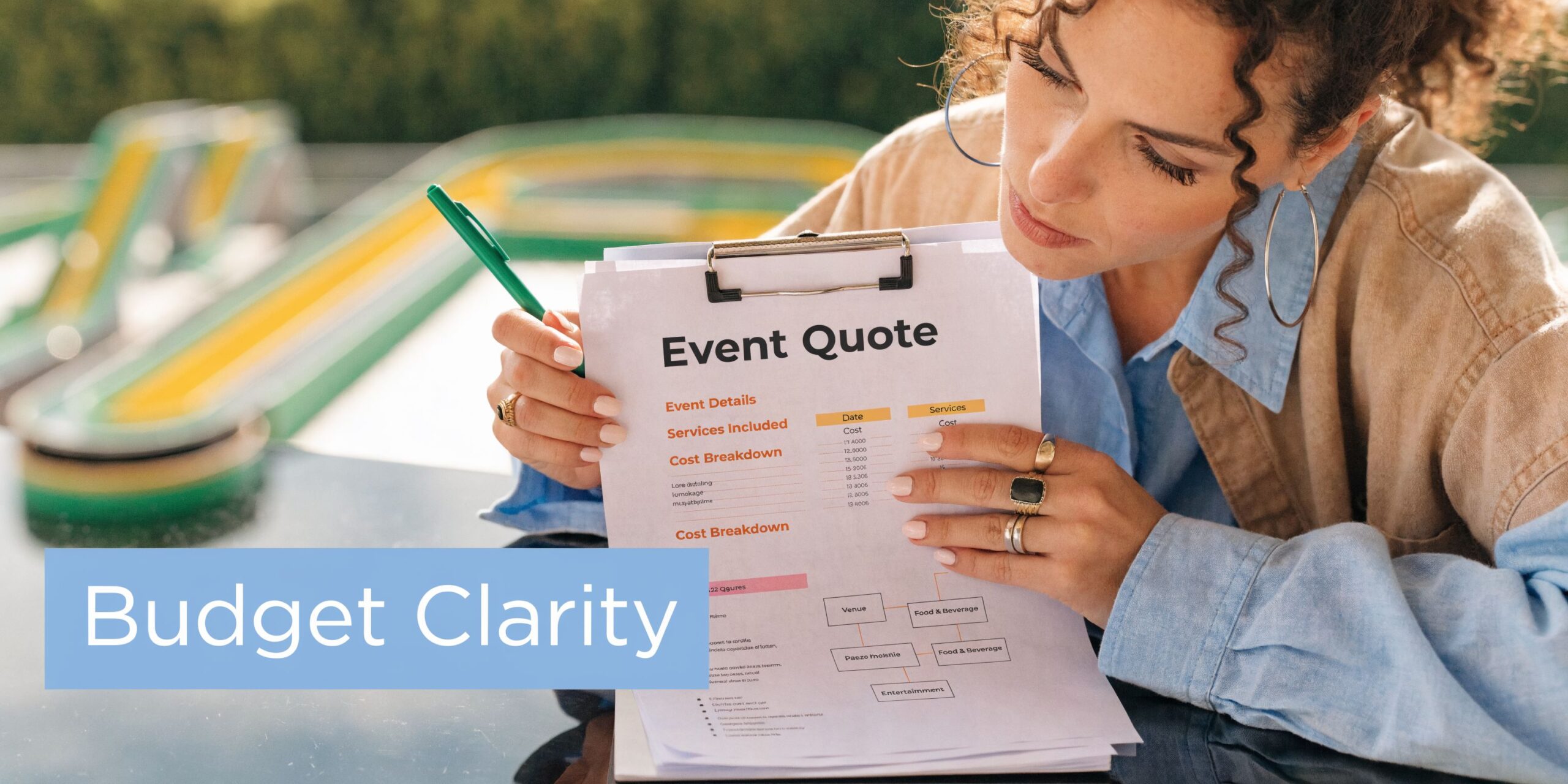 A woman reviewing an event quote document for a giant scalextric track rental for an upcoming event.