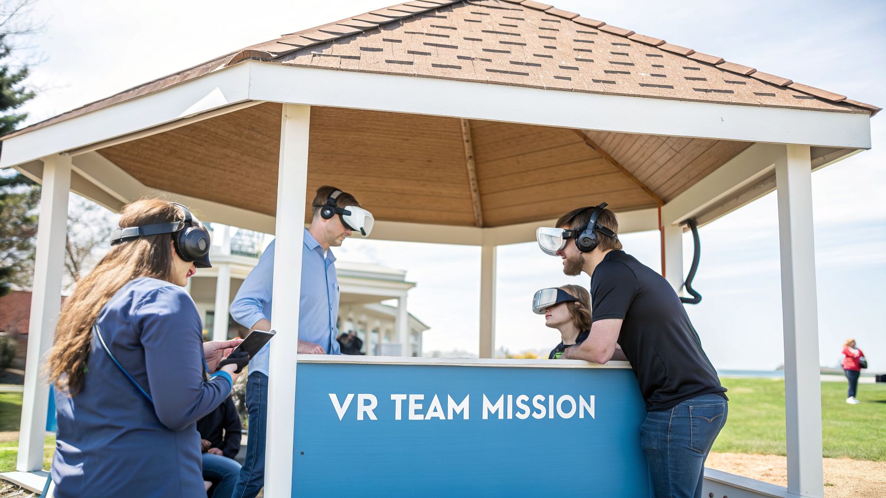 People wearing VR headsets and headphones participate in a 'VR Team Mission' outdoors under a gazebo.