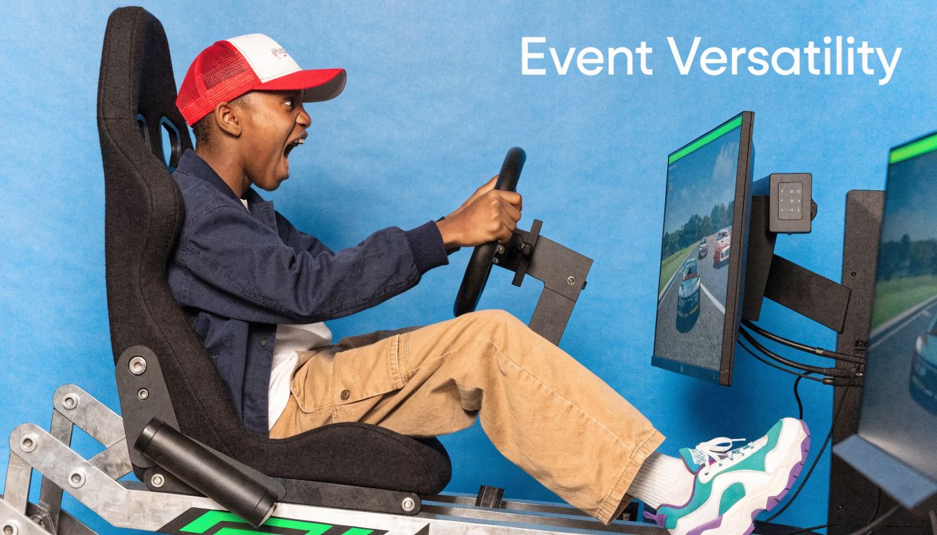 A young person excitedly driving a simulator setup in a racing seat against a blue background.