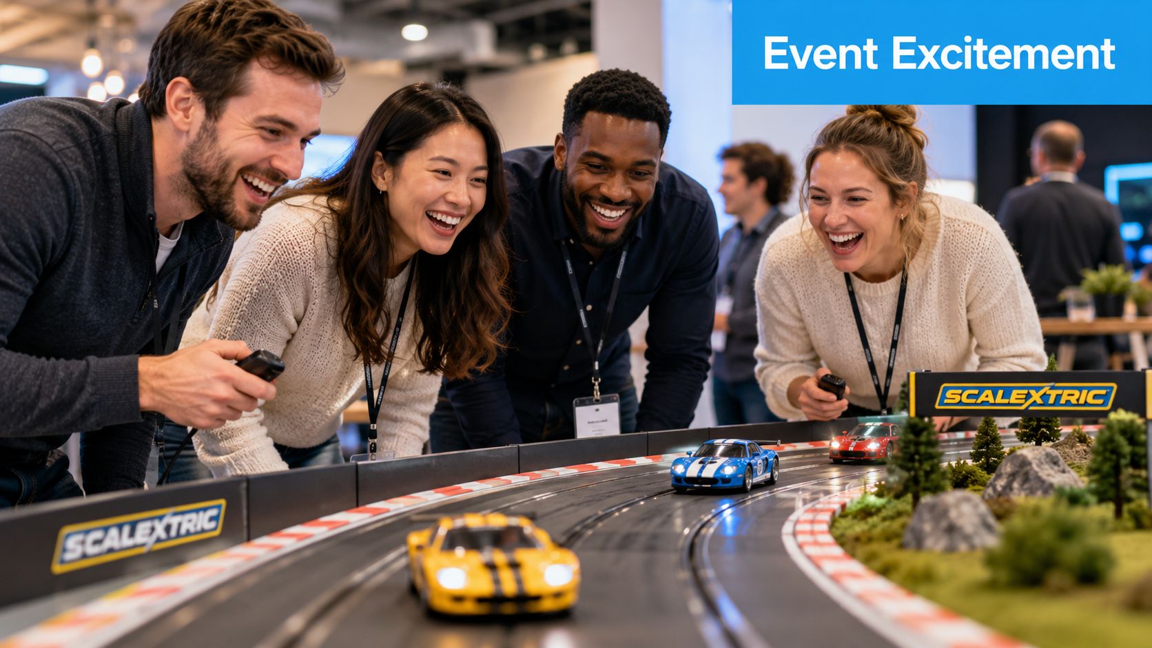 A diverse group of four professionals laughing and playing with a Scalextric slot car racing track at an event.