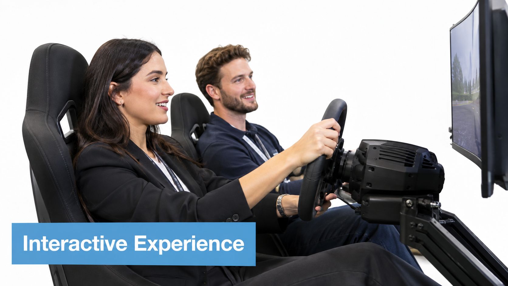 A smiling man and woman enjoying a driving simulator at a professional corporate event.